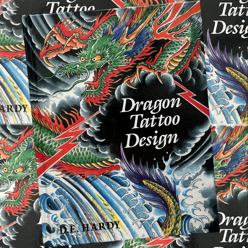 Front cover of Don Ed Hardy's Dragon Tattoo Design book featuring a color painting of a dragon with background elements of clouds, lightning, and waves.