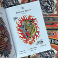 Inside pages of, 'Spitshading Tiger Heads', featuring a half skull and half tiger head, with red flames around it