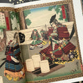 Inside pages of, 'Once more unto the Breach', featuring a samurai warrior sitting in front of a table with 3 white lanterns, speaking to another samurai