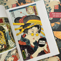 Inside pages of The Visionary Soul of Edo Horihiro featuring a geisha holding a hand mirror with "The Beatles" logo on it.