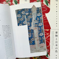 Inside pages of, 'Kimono and the Colors of Japan', featuring a blue kimono with a white and grey flower pattern 
