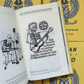 Inside pages of, 'Russian Criminal Tattoo Encyclopaedia Vol. 3', featuring a skeleton playing guitar with a communist sigil in the background and russian text underneath it