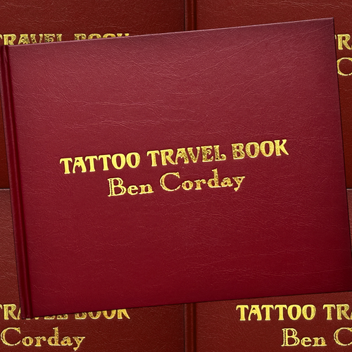 Front cover of Ben Corday's Tattoo Travel Book featuring bold gold-foil lettering on a plain maroon background.