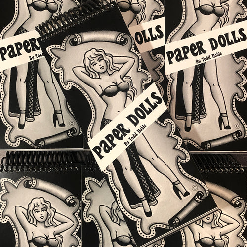 Front cover of Paper Dolls by Todd Noble featuring a traditional style black and grey rendering of a line drawing pinup posing with her hands on the back of her hair.