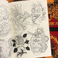 Inside pages of Heinz Sketchbook 2020 featuring line drawings of a range of traditional and Japanese imagery such as an eagle and a rose and a mask.