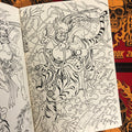 Inside pages of Heinz Sketchbook 2020 featuring a line drawing of a Japanese demon riding a tiger. The background is filled with fingerwaves, thunder, a spiral, and other shapes.