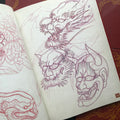 Sketches of dragons and hannya masks.