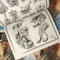 Inside pages of The Tattooers Almanac Vol. 1 featuring drawings of skulls, snakes and more