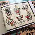 Skull and dagger art in Downtown Tattoo Flash Book.