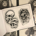 Inside pages of Lowrider Tattoo Flash featuring three different skulls.