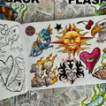 Inside pages of 'Flashback' by Aaron Bell featuring colorful flash designs such as a variation of the compass rose with a sun face, a cartoonish dragon, the number '13' made out of rock and engulfed in flames, a tribal skull design, and a textured heart with a realistic green eye crying blood. The opposite page features the respective line drawings.