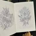 Inside pages of 'Sacrament' by Chris Stuart featuring line drawings of two iterations of the Sacred Heart.