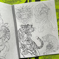 Inside pages of Gaijin Wabori Vol. 1 by Dana Helmuth featuring line drawings of tigers.