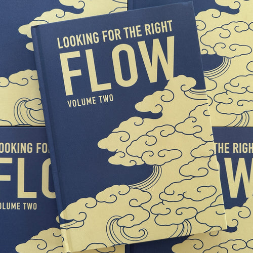 'Looking For The Right Flow Volume 2'  is a tattoo book about Japanese background studies by Fabio Gargiulo, with a blue hardcover, white text, and cloud imagery.