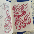 Traditional Japanese red sketches and studies of flames from 'Looking For the Right Flow Volume 2' a tattoo book by Fabio Gargiulo.