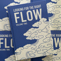 'Looking For The Right Flow Volume 2'  is a tattoo book about Japanese background studies by Fabio Gargiulo, with a blue hardcover, white text, and cloud imagery.