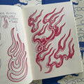 Traditional Japanese red sketches and studies of flames from 'Looking For the Right Flow Volume 2' a tattoo book by Fabio Gargiulo.