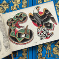 Inside pages of Bangers & Flash Vol. 2, featuring two drawings of an eagle perched on a skull, and a rattlesnake, both in traditional colors and style