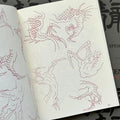 Inside pages of Garyotensei, featuring sketches of various dragon claws in different positions