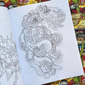 Inside pages of Shaun Topper's Line Drawings vol. 2 featuring line drawings of tiger and dragon fighting.