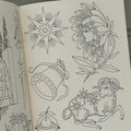 Inside pages of Sterling Barck's, 'Permanence', featuring line drawings of stars, a bell, a lady head inside a flower, a lamb with stars over it, and a mouth with a cherry. 