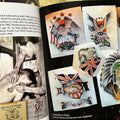 Inside pages of The Pioneers of British Tattooing Vol. 1 featuring text, a photograph of someone being tattooed, business cards, and a few George Bigmore designs.
