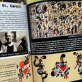 Inside pages of The Pioneers of British Tattooing Vol. 1 featuring text, flash designs, and a painted banner.