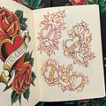 Inside pages of Keep It Real by Rinto featuring sketches and a full color drawing of roses and hearts with banners.