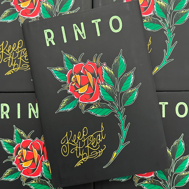 Front cover of Keep It Real by Rinto featuring a color drawing of a rose on a black background.