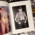 Inside pages of "You Had to Be There" by Billy Tinney featuring vintage photographs of a man showcasing his tattoos.