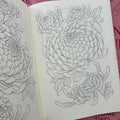 Inside pages of Japanese Flora Vol. 2 by Sören Sangkuhl featuring sketches of chrysanthemums.