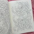 Inside pages of Japanese Flora Vol. 2 by Sören Sangkuhl featuring sketches of chrysanthemums.