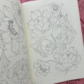 Inside pages of Japanese Flora Vol. 2 by Sören Sangkuhl featuring sketches of lotus flowers.