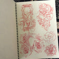 Inside pages of The Zeitgeist Book of Sketches featuring red pencil drawings of roses, snakes and more.