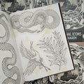Inside pages of Traditional Icons by Rich Hardy featuring line drawings of a snake, a bird, and a plant.