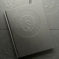 Front cover of OG Abel Sketchbook featuring a black matte cover with embossing of the title and logo.