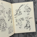 Inside pages of Inkumaku by Salvio featuring line drawings and sketches of Japanese frogs.
