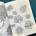 Inside pages of unrefined by Evan Griffiths featuring line drawings and sketches of flowers.
