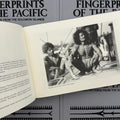 Inside pages of book 'Fingerprints of the Pacific' by Will Cattersel featuring a photograph of Mungaba native inhabitants.