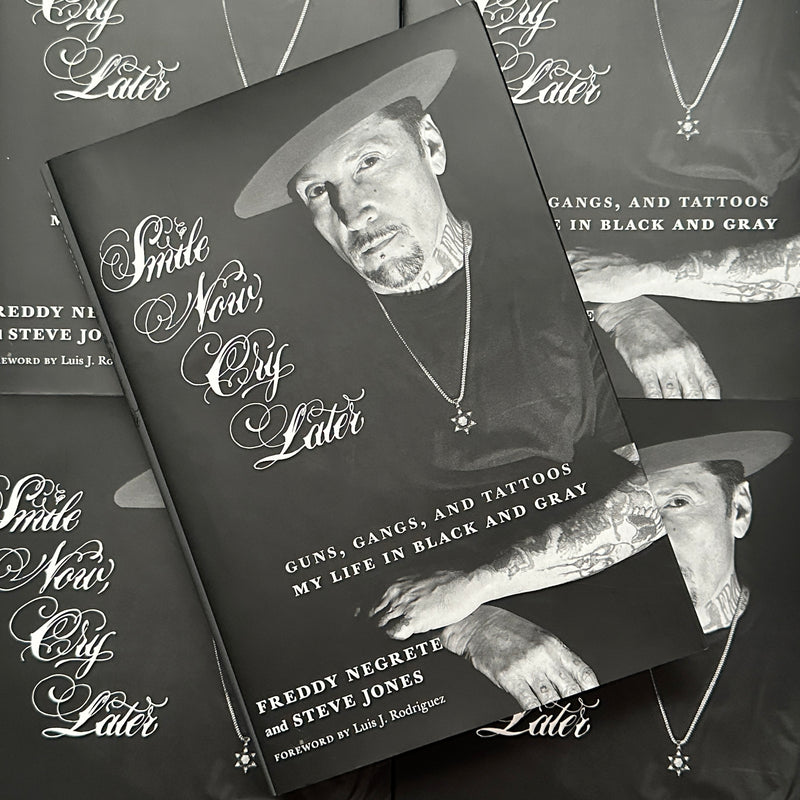 Front cover of Smile Now, Cry Later by Freddy Negrete featuring a portrait of Freddy on a black background and white lettering for the title.