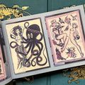 Inside pages featuring pinup girls, hearts, a black octopus, butterflies, and more painted in traditional style and colors.