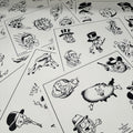 a selection of sheets of Buddy Holiday flash spread out featuring playing dice and cards, skulls in top hats, a longhorn, cowboy heads, lady heads, a silhouette of the USA, a plane, a flaming devil head, and much more. All painted in traditional style and black ink.