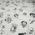 a selection of sheets of Buddy Holiday flash spread out featuring a skull and crossbones, hearts and foliage, crosses, ducks, ghosts, flaming skulls, and much more. All painted in traditional style and black ink.