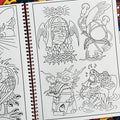 Inside pages of Dan Moreno's 'Magic Moreno Sketchbook Volume 1' featuring a panther head with a frog on top, a dragon head, a catfish swimming with a peach, and a lady head with wings and thorns.