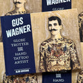 Front cover of Alan Govenar, 'Gus Wagner - Globe Trotter and Hand Tattoo Artist' featuring Gus Wagner shirtless, showing his tattooed chest and torso.