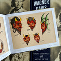 Inside pages of tattoo book "Lotteva Wagner Davis : Hand Tattooist & Artist of the American West" featuring flash art of devil heads by Lotteva.