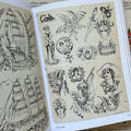 Inside pages of, 'Tattoo', featuring two flash drawings of lady heads, flags, daggers, fans, snakes, and more