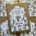 Front cover of 'Russian Criminal Tattoo Archive', featuring a torso with various tattoos over a gold background