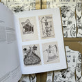 Inside pages of, 'Russian Criminal Tattoo Archive', featuring 4 different tattoo designs of skeletons and russian text 