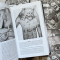 Inside pages of, 'Russian Criminal Tattoo Police Files. Vol 1', featuring a hand tattoo of a skull with a dagger and various knuckle tattoos representing the prisoner's crimes and sentences, with English text at the bottom